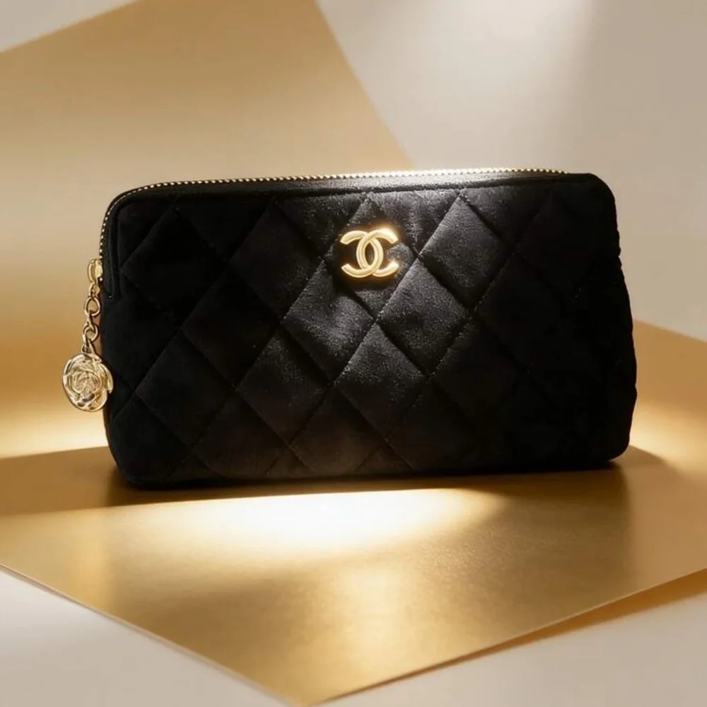 CHANEL Black Quilted Clutch with Gold Logo - Picture 2 of 4
